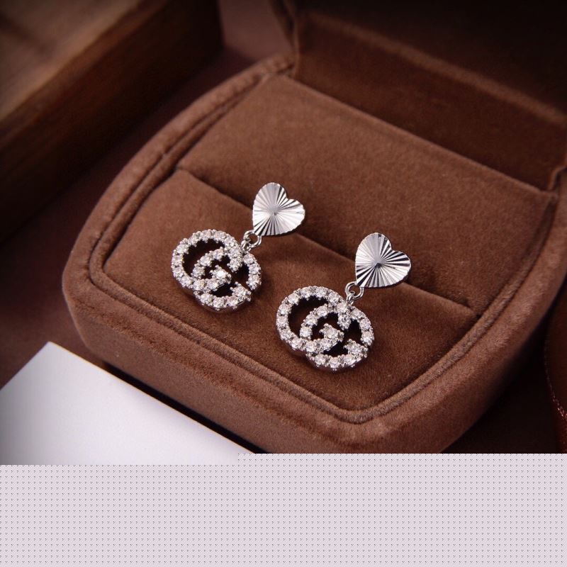 G*u*i earrings